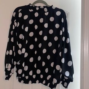 Black women’s blouse with white polkadots